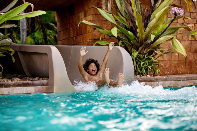 Child enjoys Walt Disney World Resort hotel pool - Tips to Stay Cool at Disney World