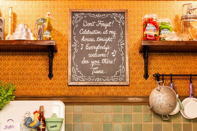 Tiana's kitchen in the queue for Tiana's Bayou Adventure