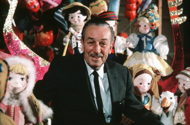 Walt Disney with dolls from "it's a small world" - 'it's a small world' history