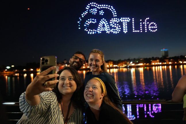 Cast members pose at the "Disney Dreams That Soar" cast preview