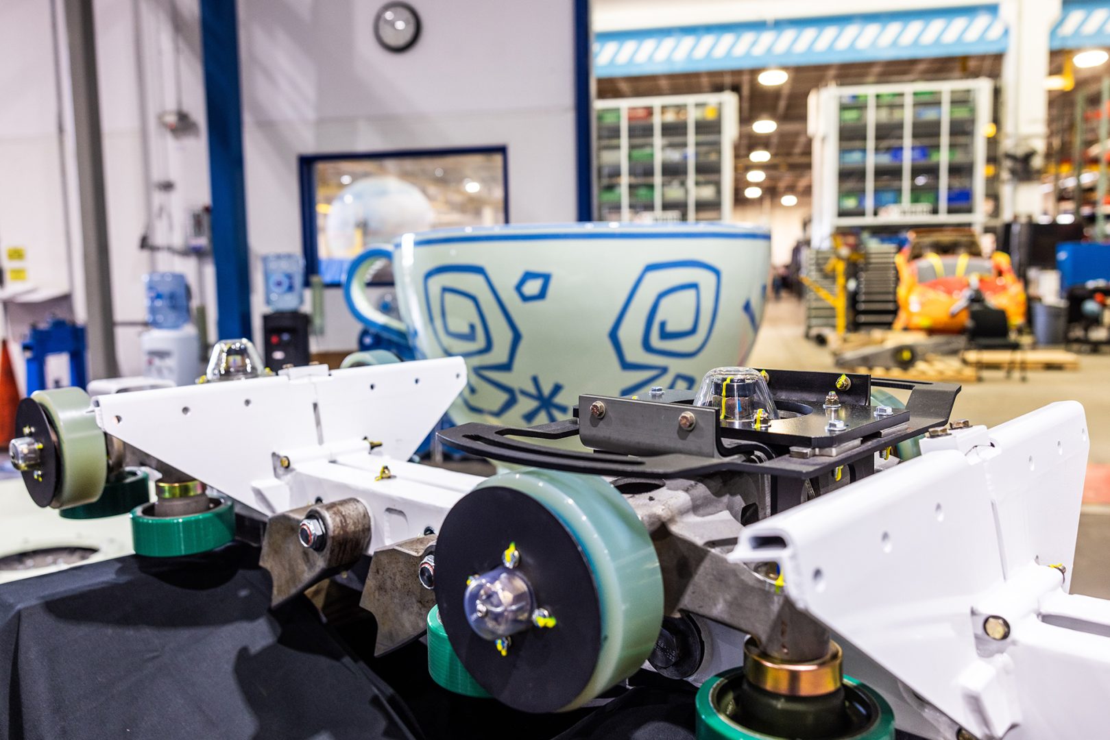 Mechanics and teacup ride vehicle inside Central Shops at Disney World