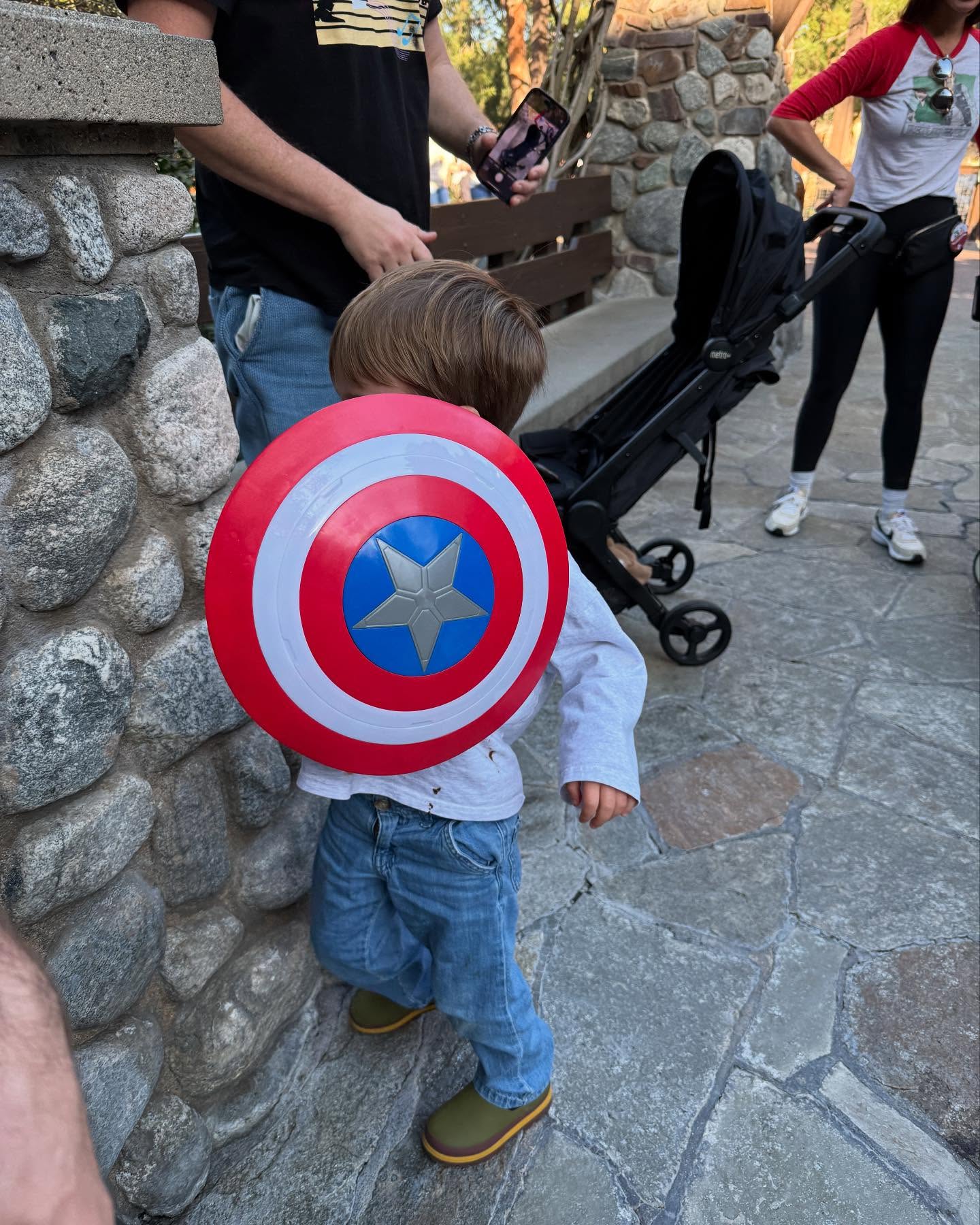 Mandy Moore's son holding the Captain America shield.