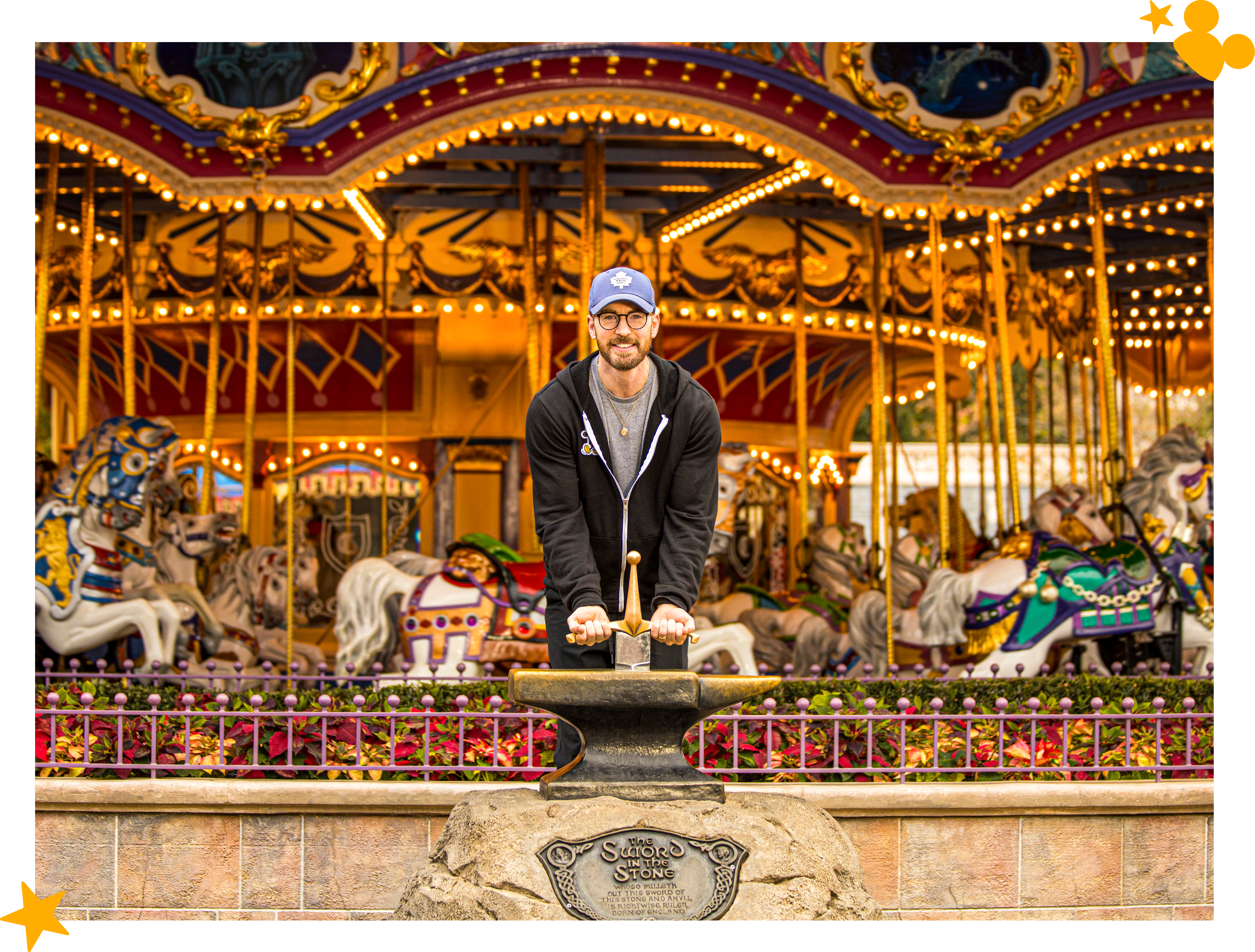 Chris Evans attempting to pull the sword out of the Sword in the Stone.