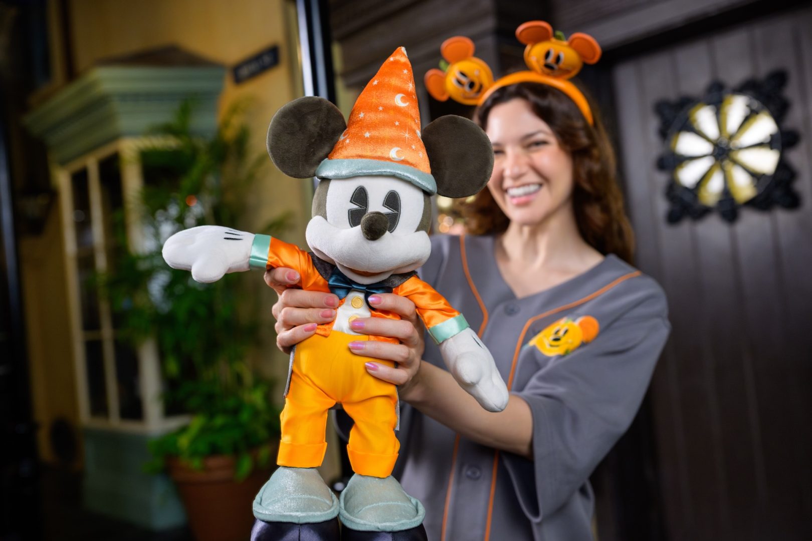 Woman holding Mickey Mouse Halloween Plush 