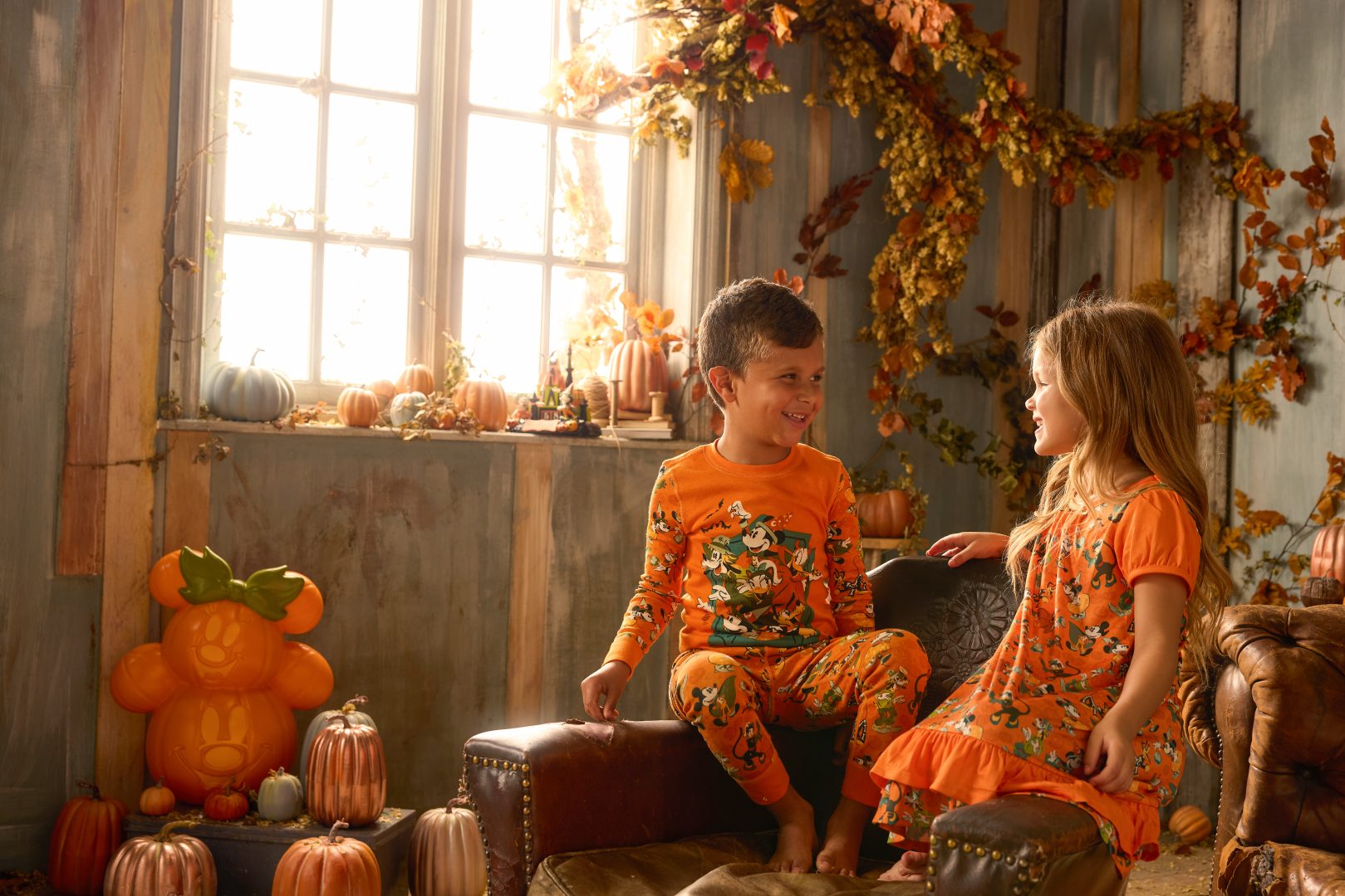 Kids wearing Mickey Mouse and Friends Halloween Pajama Pals sets 