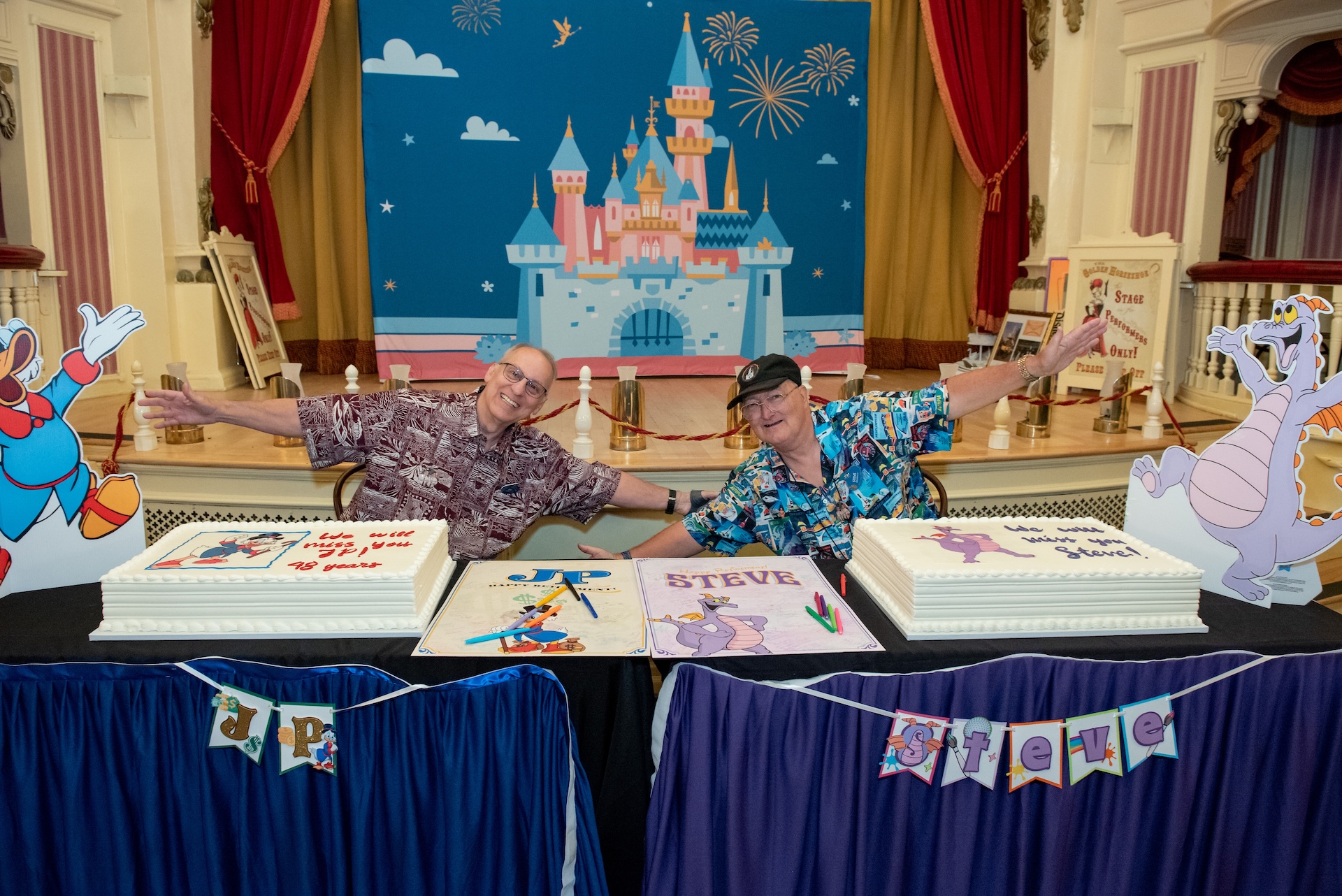 JP and Steve with their celebratory cakes and posters