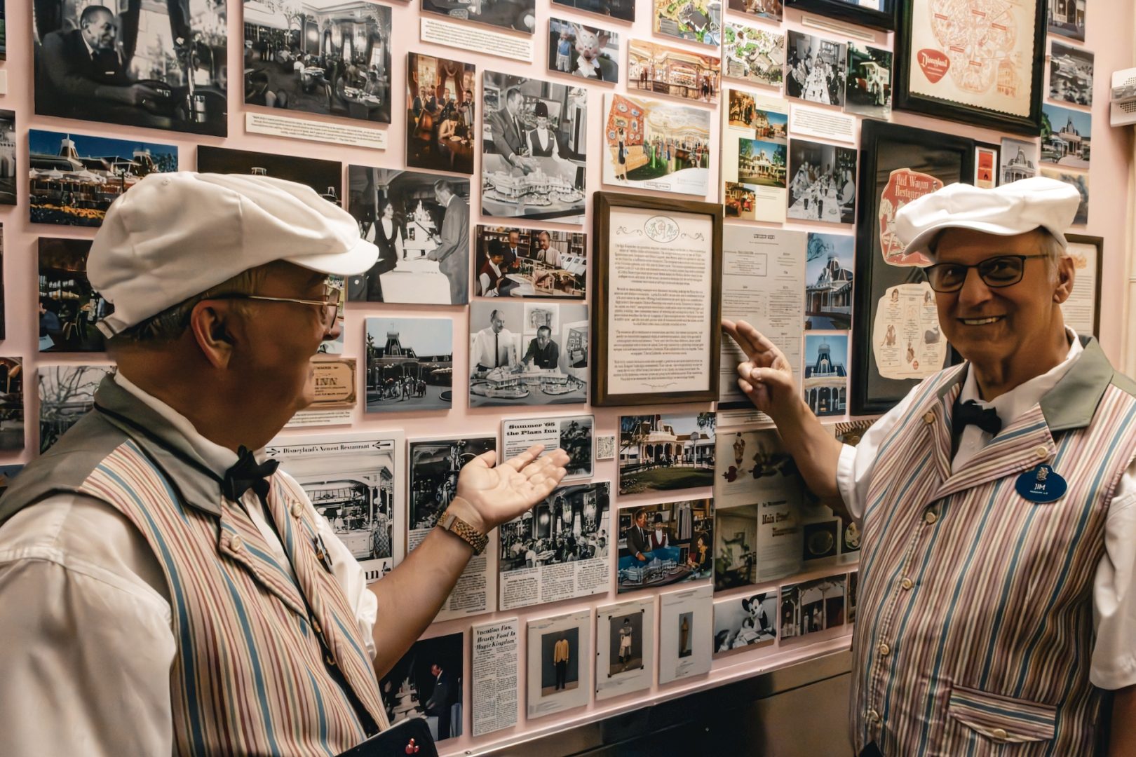 Steve and JP with photos and artifacts from the Plaza Inn “Legacy Wall"