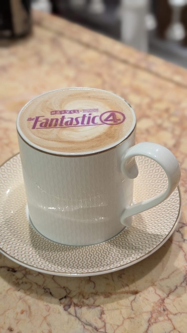Latte art with purple Fantastic Four logo