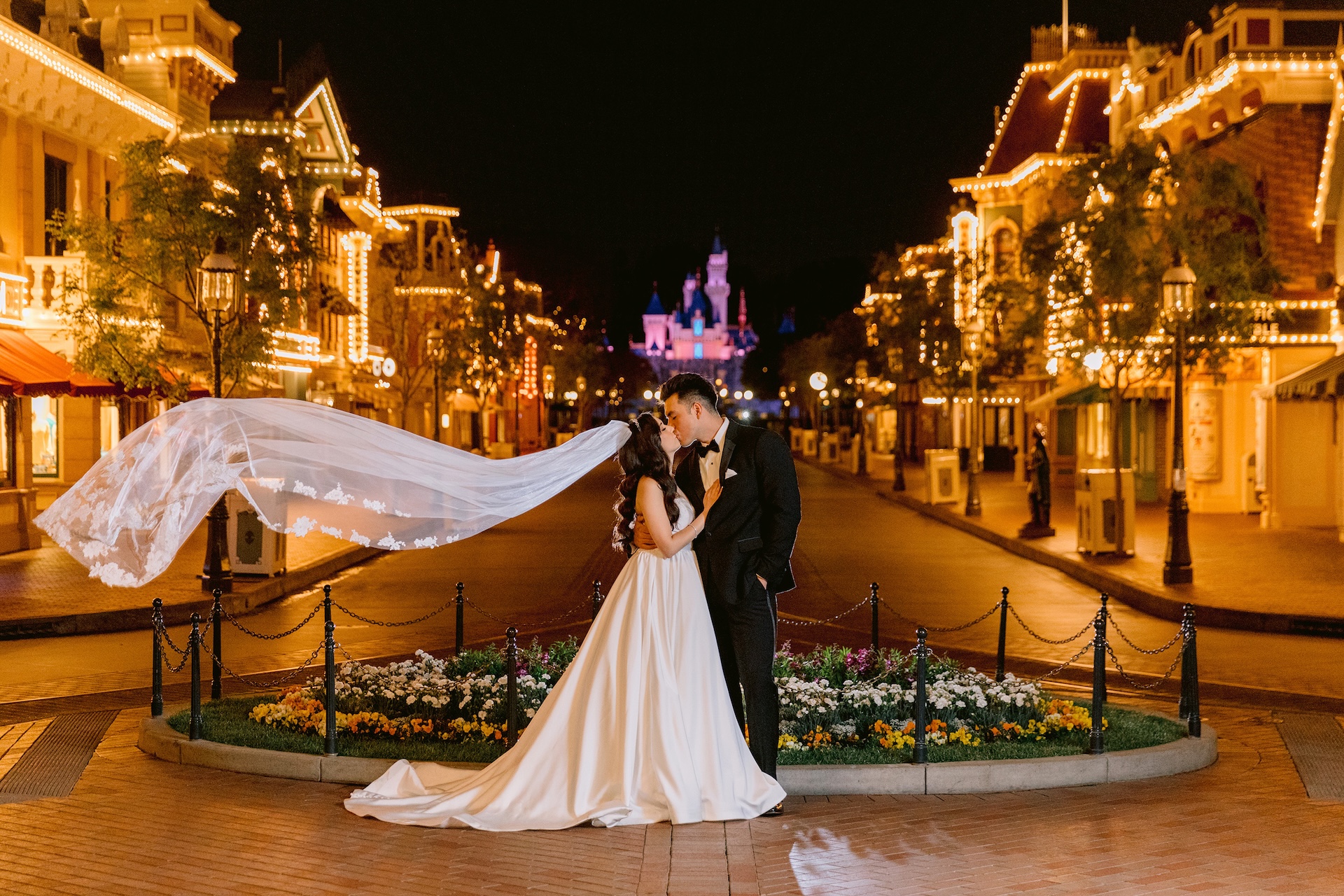 Disney's Fairy Tale Weddings Bride and Groom at Disneyland Park on Main Street