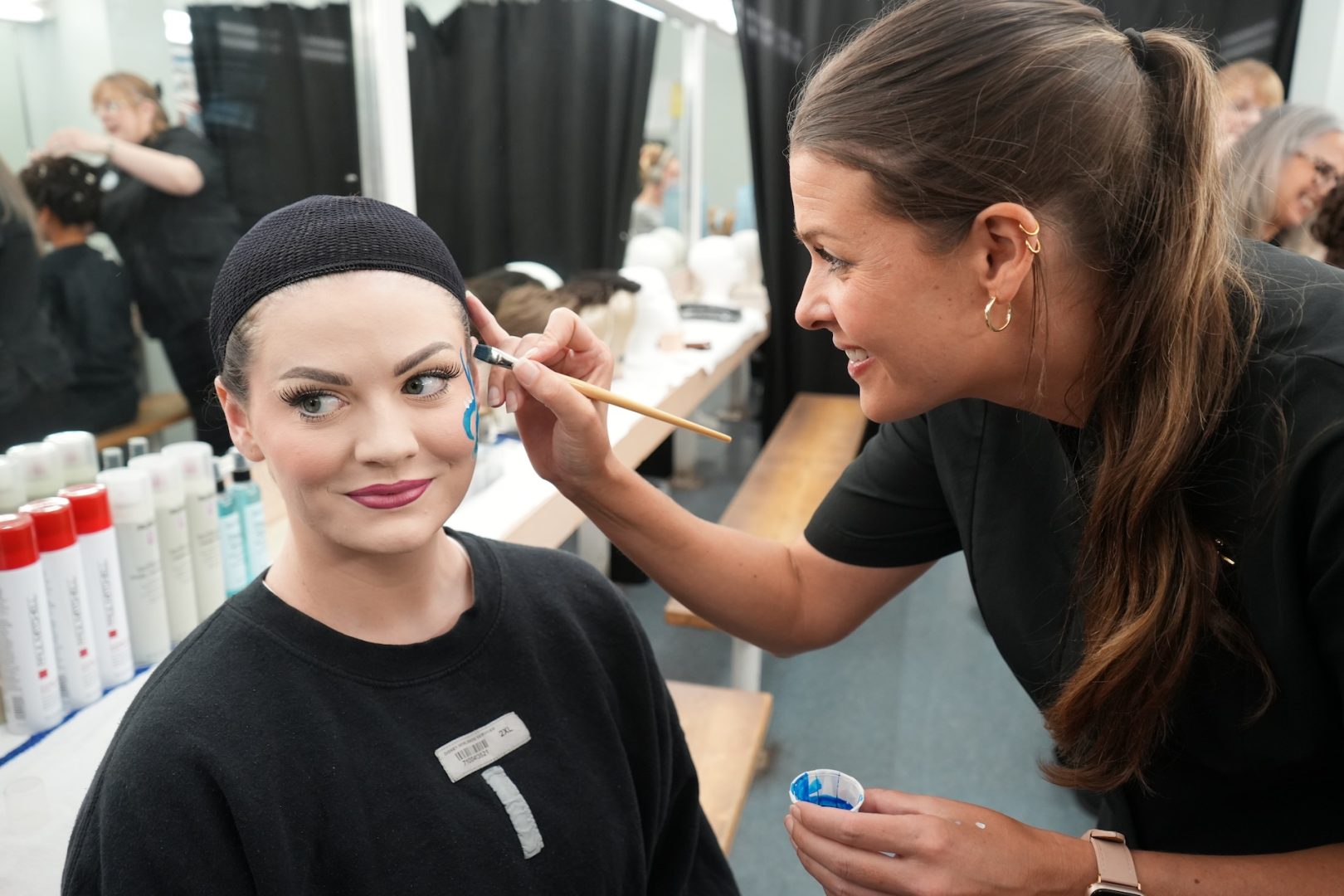 Deirdre, Performer and Kate, Costuming Leader doing Disney Starlight makeup in the dressing room