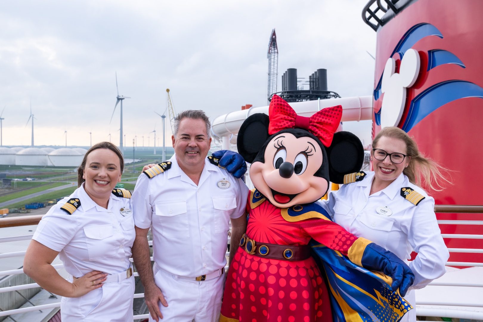 Crew members and Minnie Mouse during the Disney Destiny crossing