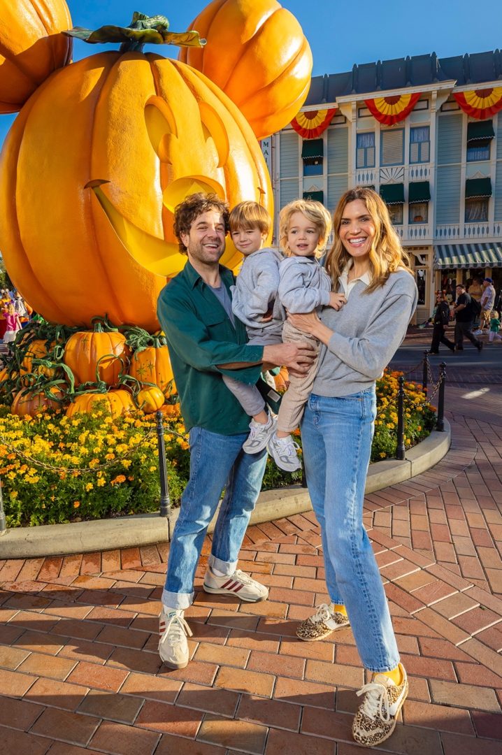 Mandy Moore and family visit Disneyland park at Halloweentime