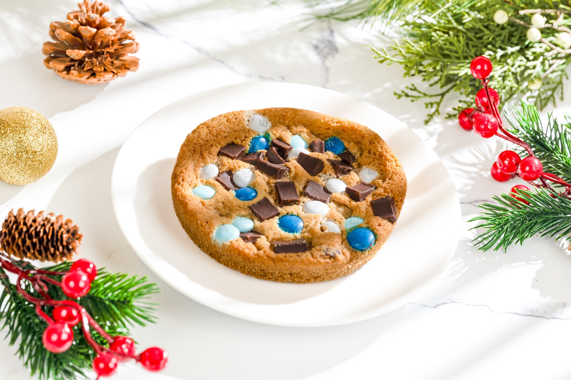 Chocolate Chunk Cookie: Chocolate chunk cookie made with M&M'S Milk Chocolate Candies Winter Blend, chocolate chunks, and sea salt (New) 