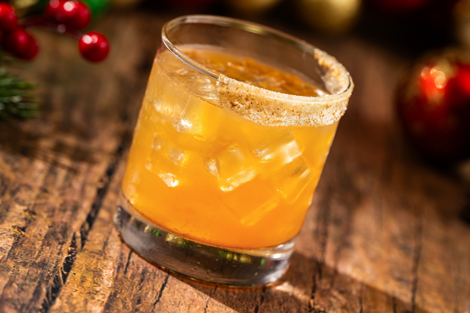 Jolly Holly Cocktail: Grainger's Deluxe Organic Vanilla Vodka, Myers's Original Dark Rum, butterscotch syrup, and apple cider garnished with a sugared graham cracker rim
