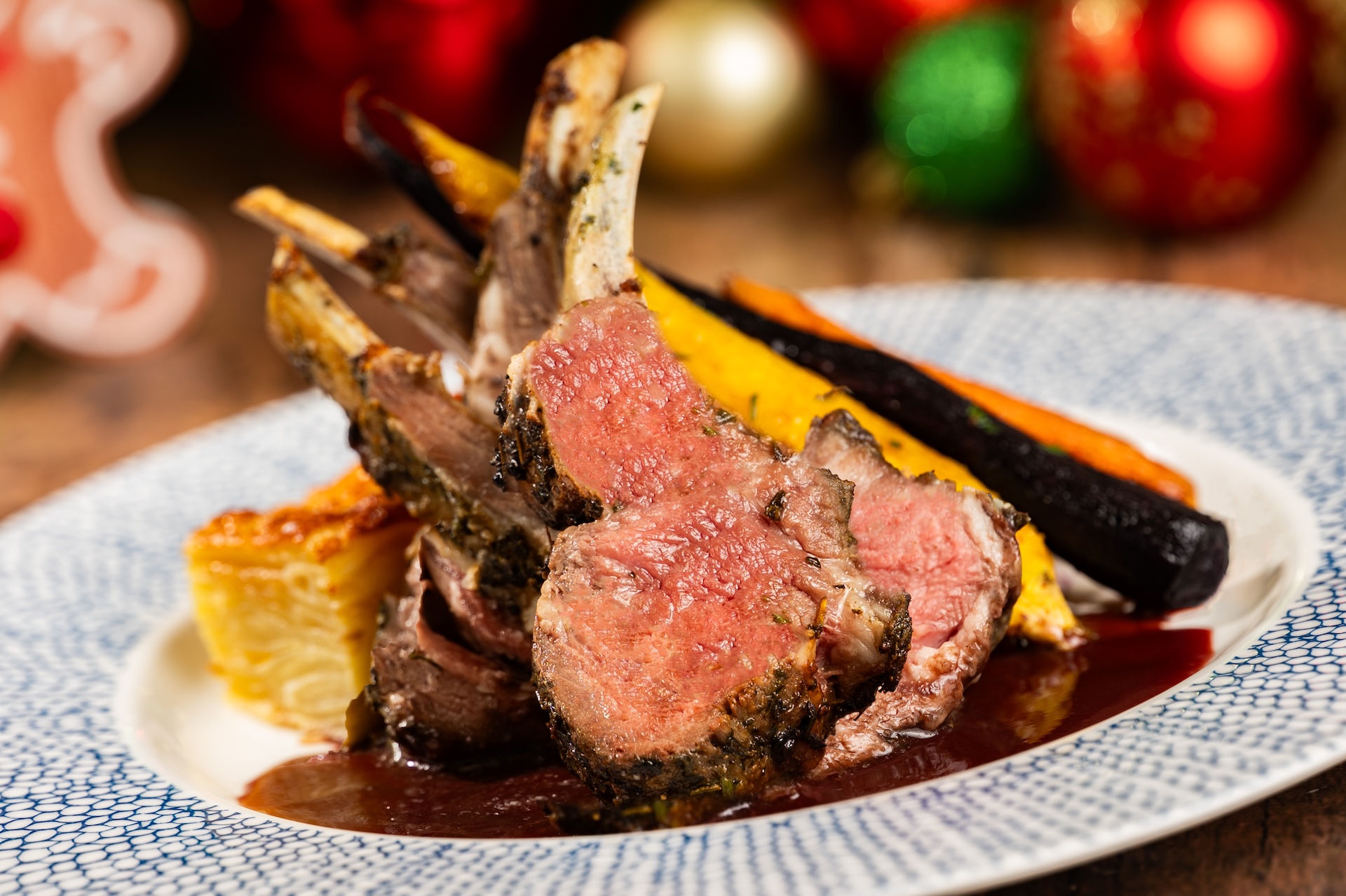 Roasted Lamb Chops: Potatoes au gratin, honey-glazed carrots, and cabernet-cherry jus