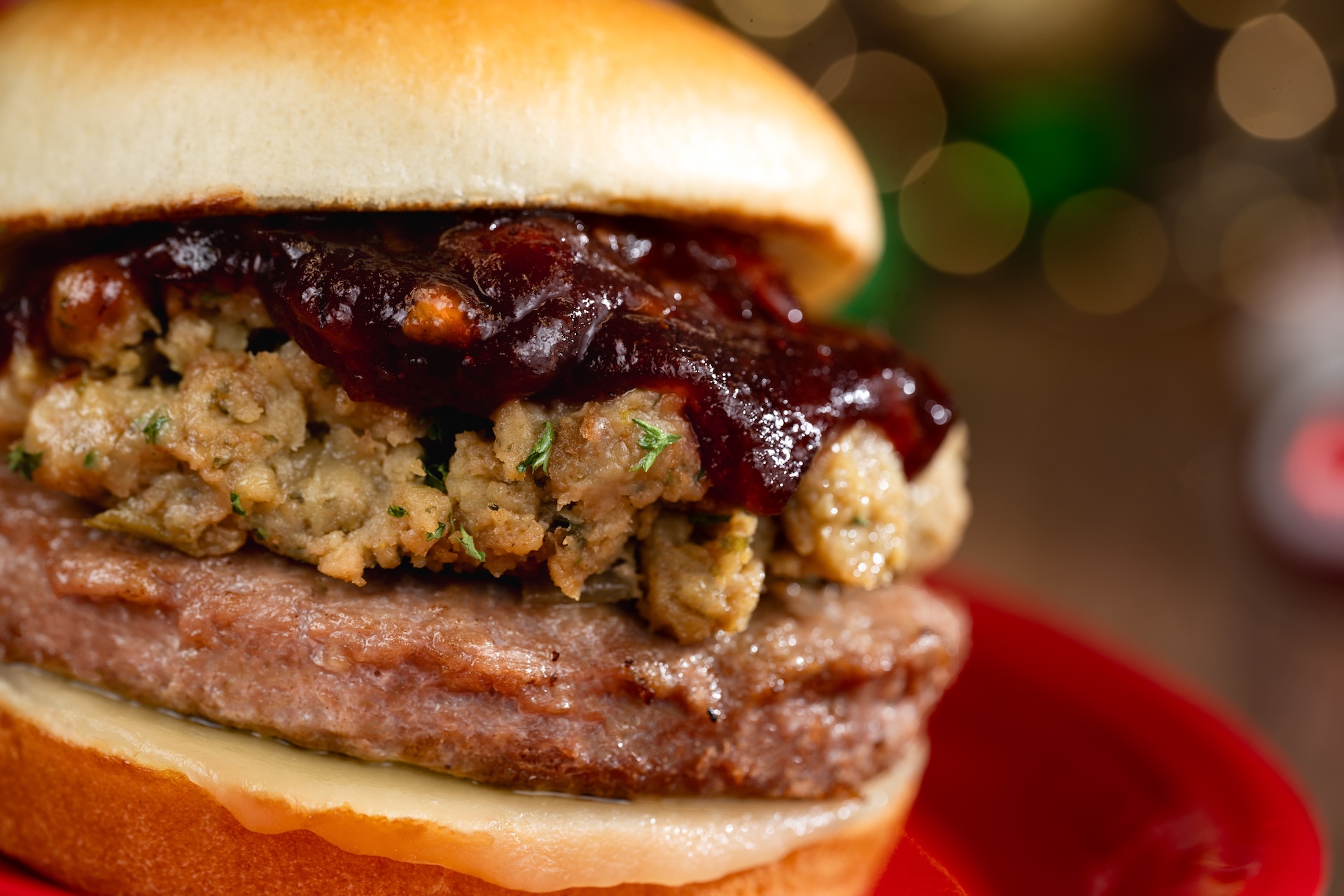 Holiday Turkey Burger topped with traditional stuffing, Swiss cheese, and cranberry chutney on a brioche bun