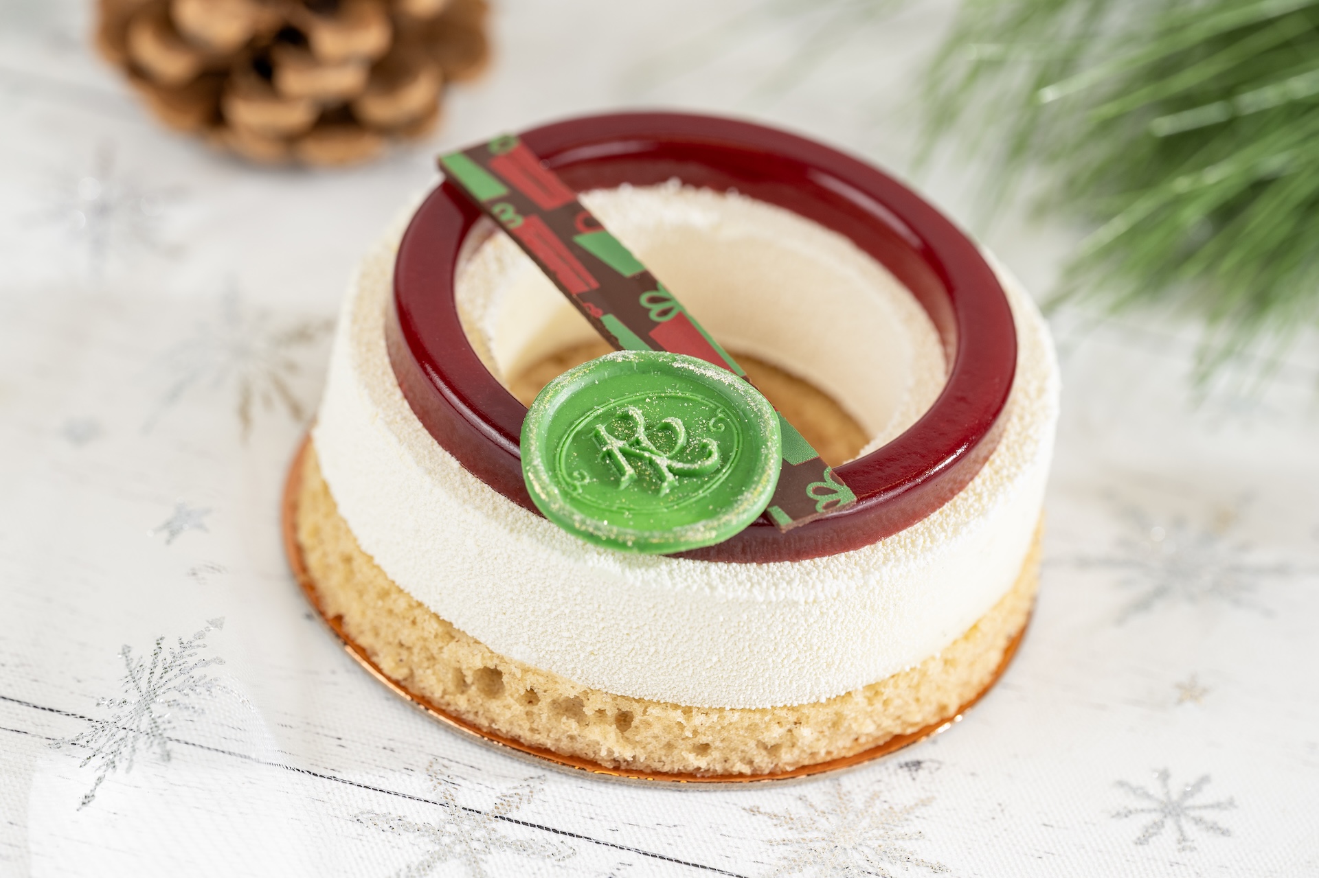 Gingerbread Eggnog Entremet: Gingerbread financier, eggnog panna cotta, and raspberry gel 