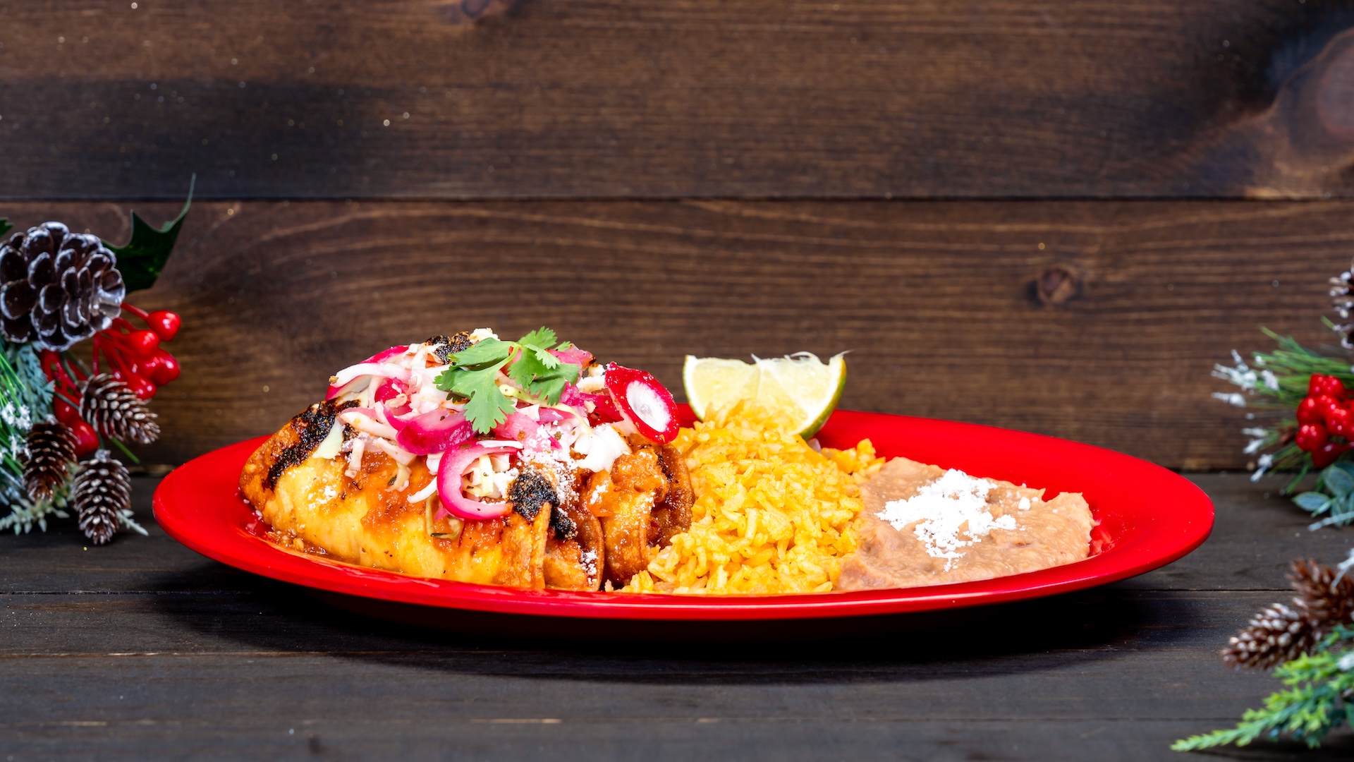 Tacos Dorados de Camarón: Two shrimp tacos fried to a golden brown topped with zesty slaw, salsa roja, salsa macha, and crema served with Spanish rice and refried beans (New)
