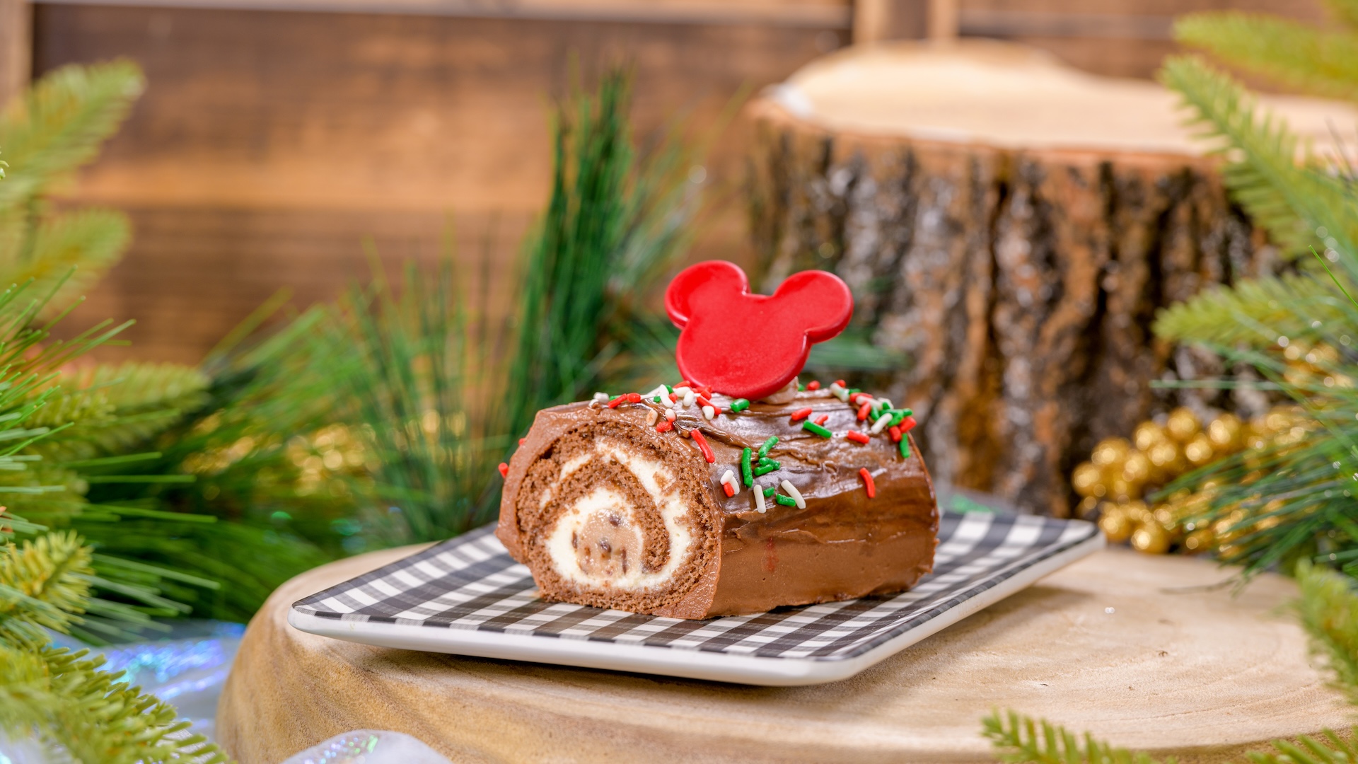 Cookie Dough Yule Log filled with chocolate chip cookie dough and white chocolate mousse covered with chocolate buttercream