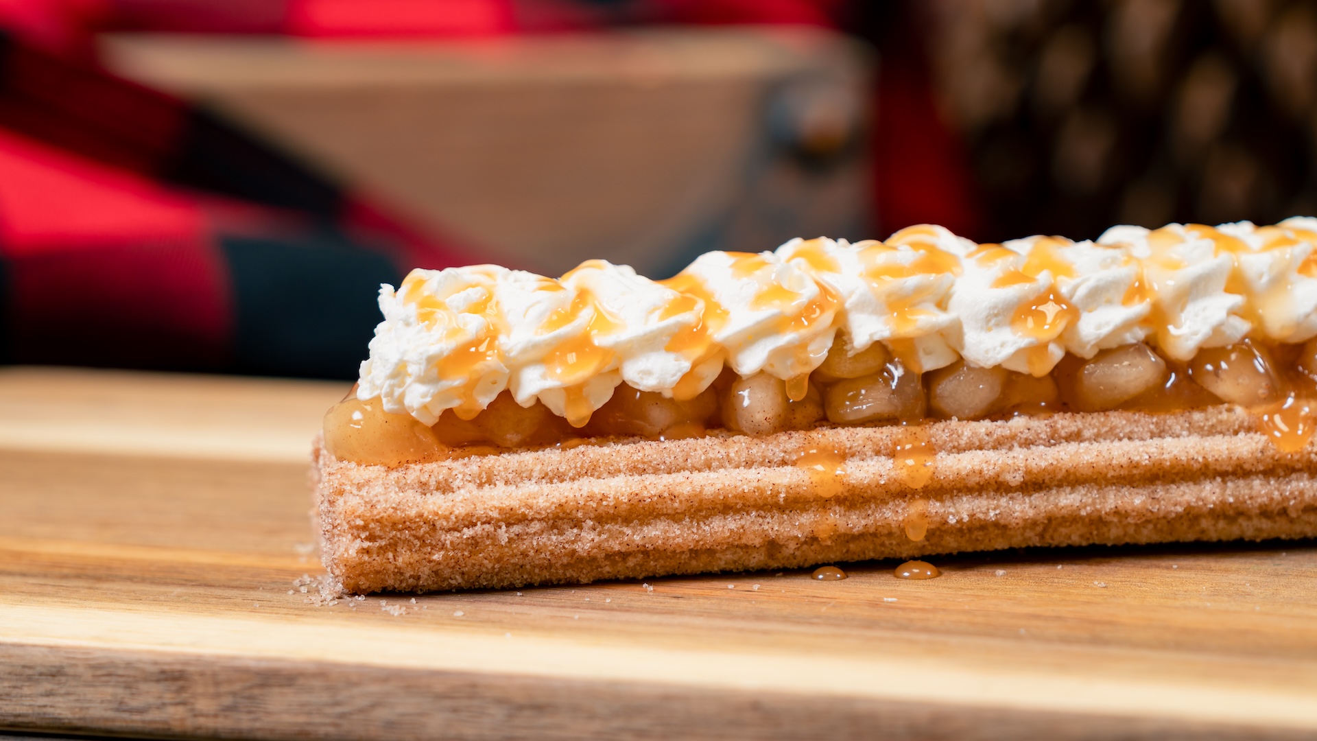 Apple Pie Churro: Classic churro with graham cracker sugar, apple pie filling, whipped topping, and caramel (New) 
