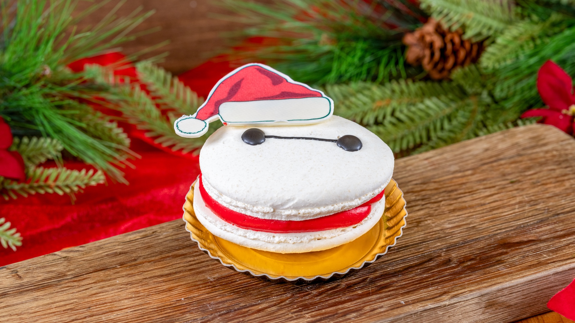 Santa Baymax Macaron filled with peppermint buttercream, chocolate ganache, and dark chocolate crunchies  