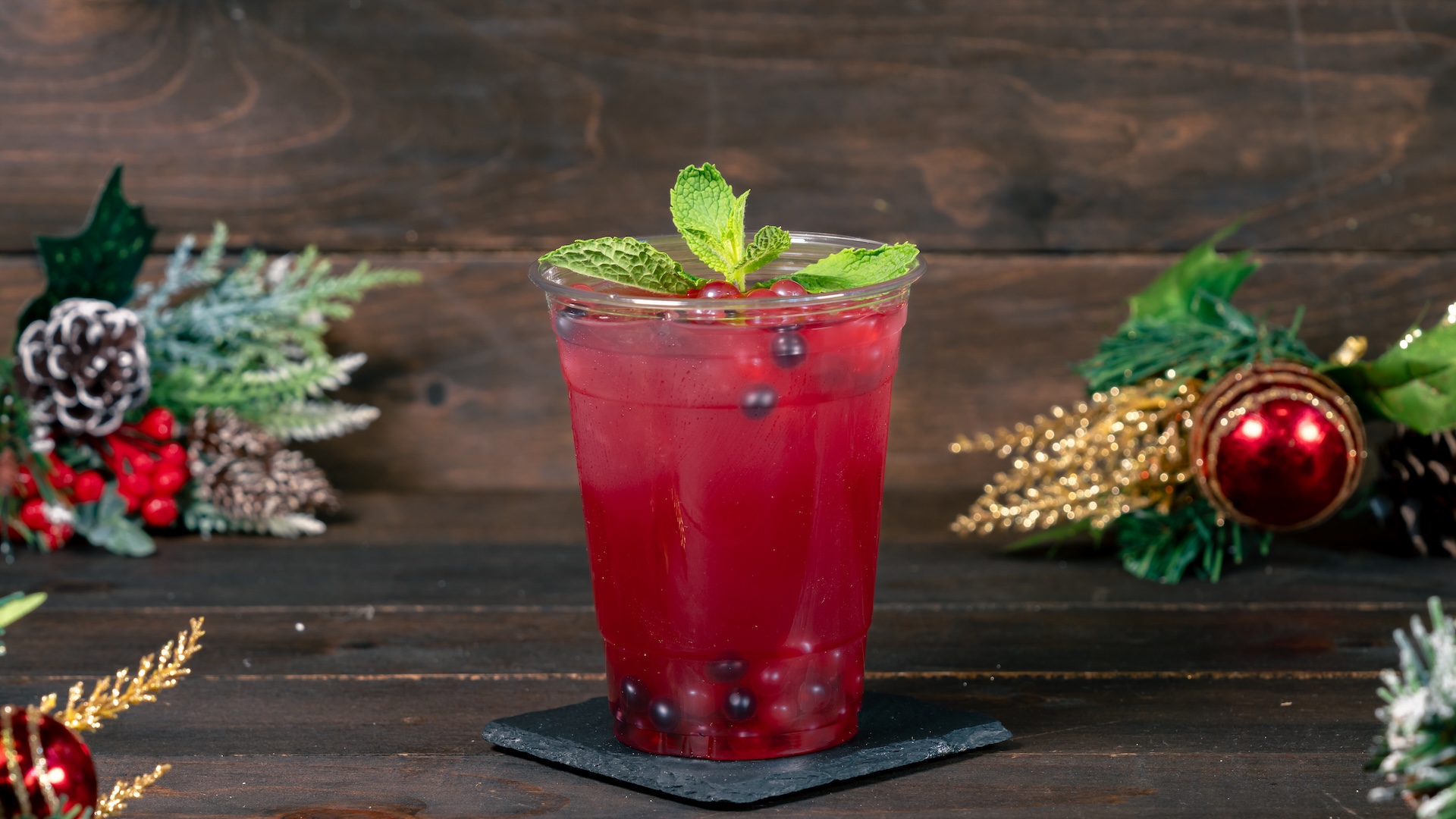 Cranberry-Pomegranate Mint Julep with mixed berry-flavored popping spheres (Non-alcoholic) 