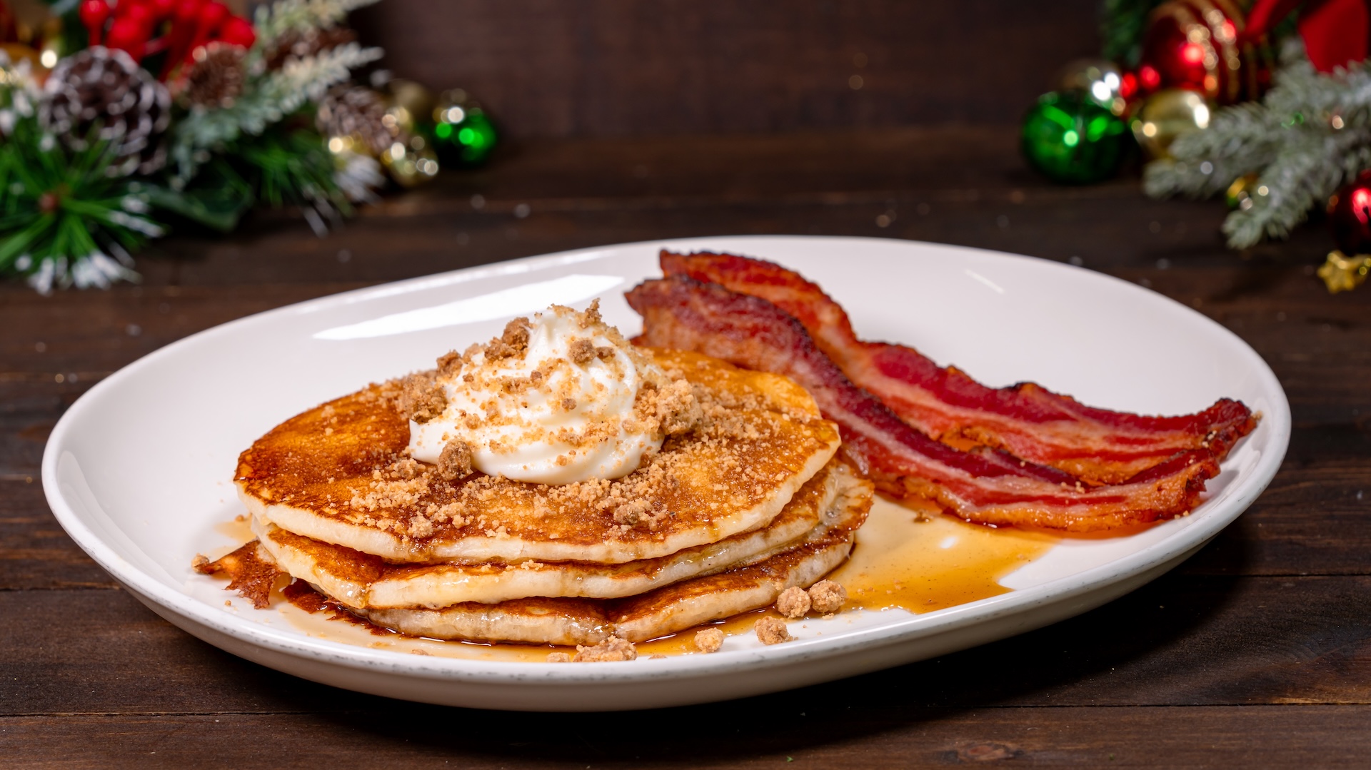 Gingerbread Pancakes: Gingerbread sauce, spiced streusel, and vanilla chantilly cream, with choice of bacon or sausage 