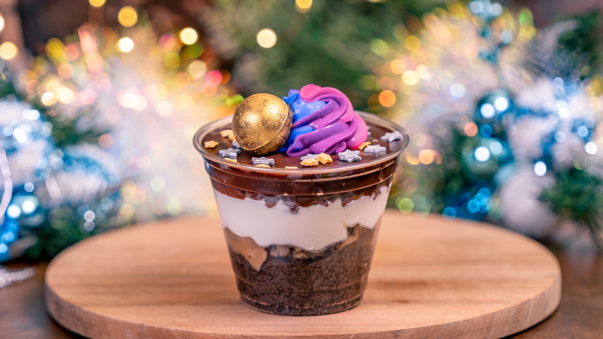 Holiday Parfait: Layers of chocolate cake, edible cookie dough, marshmallow mousse, chocolate crunch, chocolate mousse, and ganache finished with colored mousse, star glitter, and truffle shell (New) 