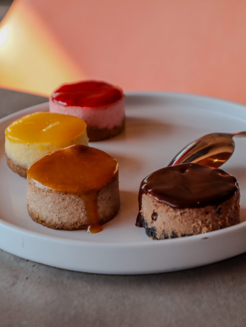 Seasonal Mini Cheesecakes including Peppermint Chocolate, Pumpkin Spice, Mango, and Strawberry  