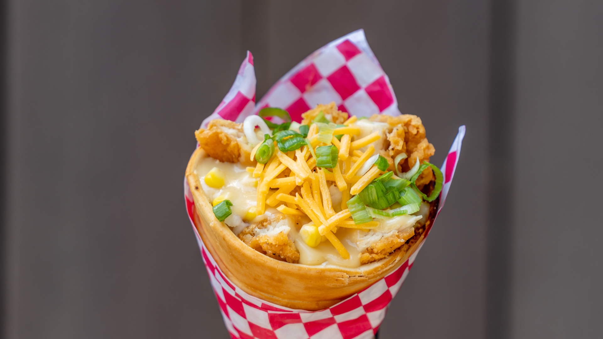 Jerry’s Junk Truck Cone: Chopped fried chicken, garlic mashed potatoes, corn, chicken gravy, and cheese topped with green onions (New) 