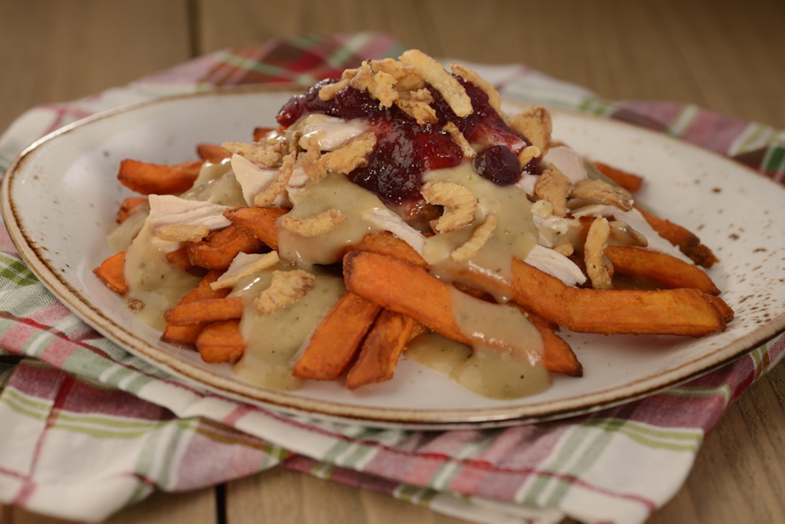 Turkey Poutine: Sweet potato fries with turkey gravy, cranberry relish, and crispy onions