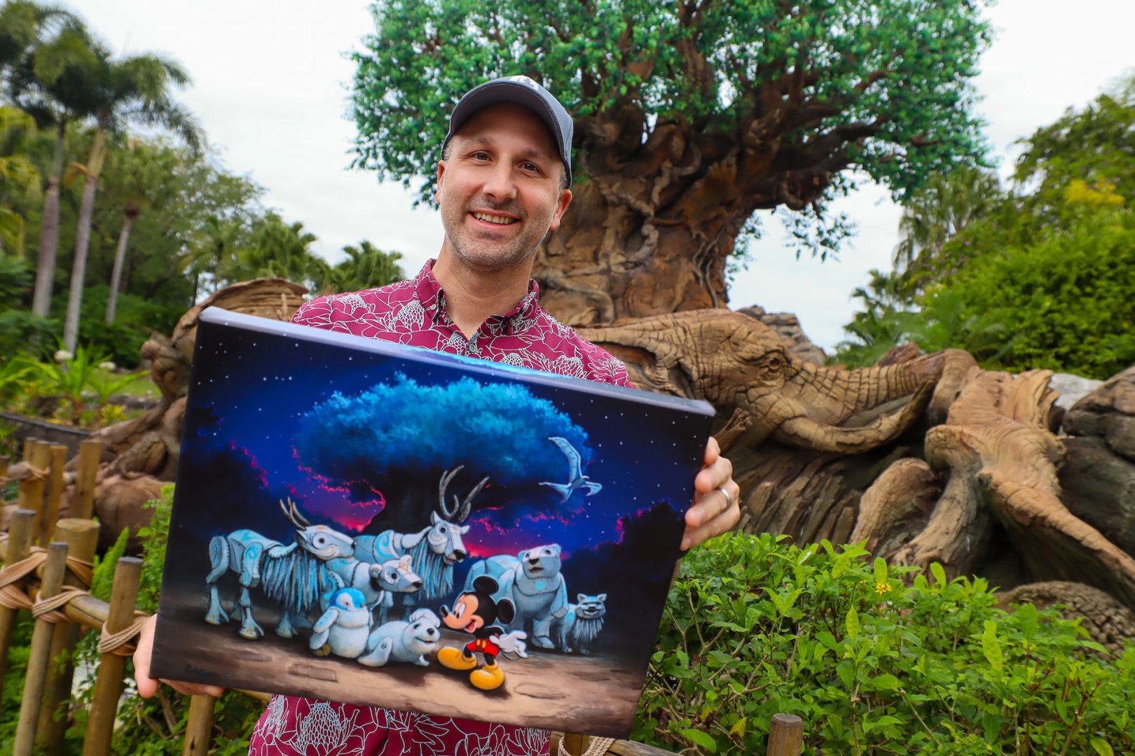 Artist Rob Katz and his Merry Menagerie art piece at Animal Kingdom