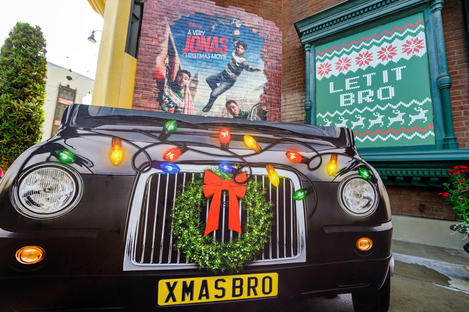 XMAS Bro Car from A Very Jonas Christmas Movie and Let It Bro Signage