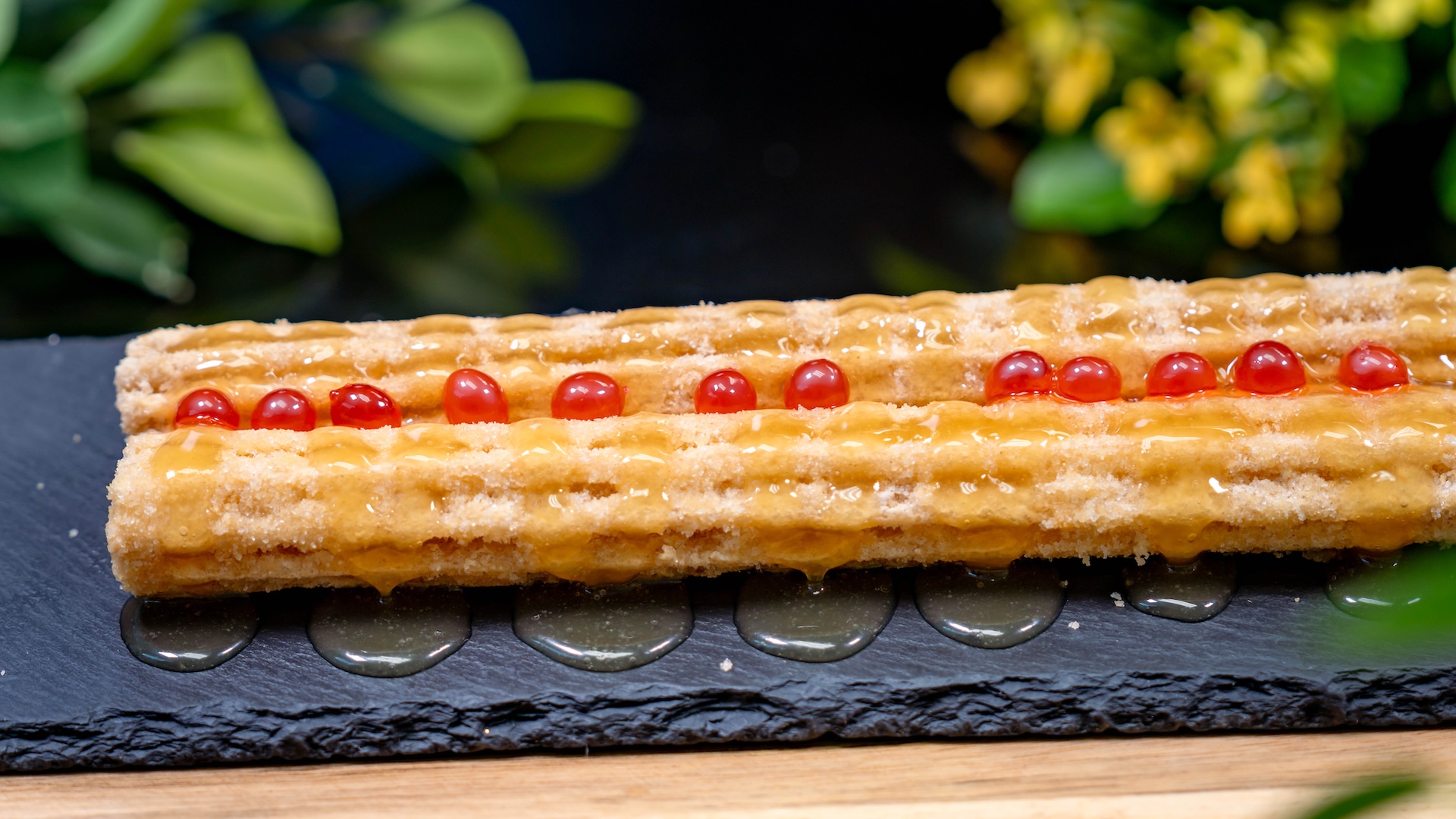 Feng Li Su Churro: Churro rolled in shortbread sugar topped with pineapple jelly and cherry-flavored popping pearls (New)