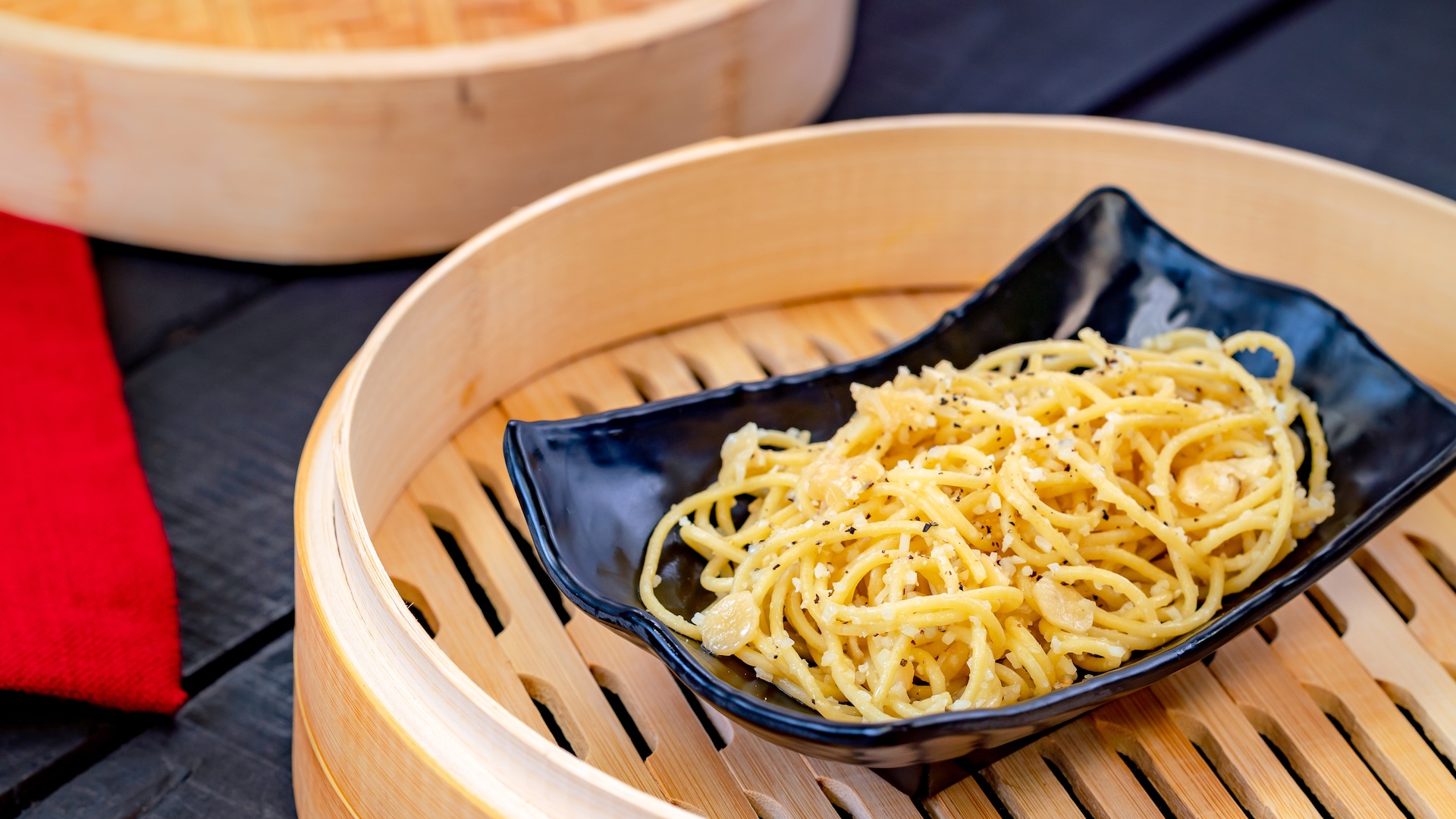 Garlic Noodles: Long noodles tossed in zesty garlic butter with parmesan
