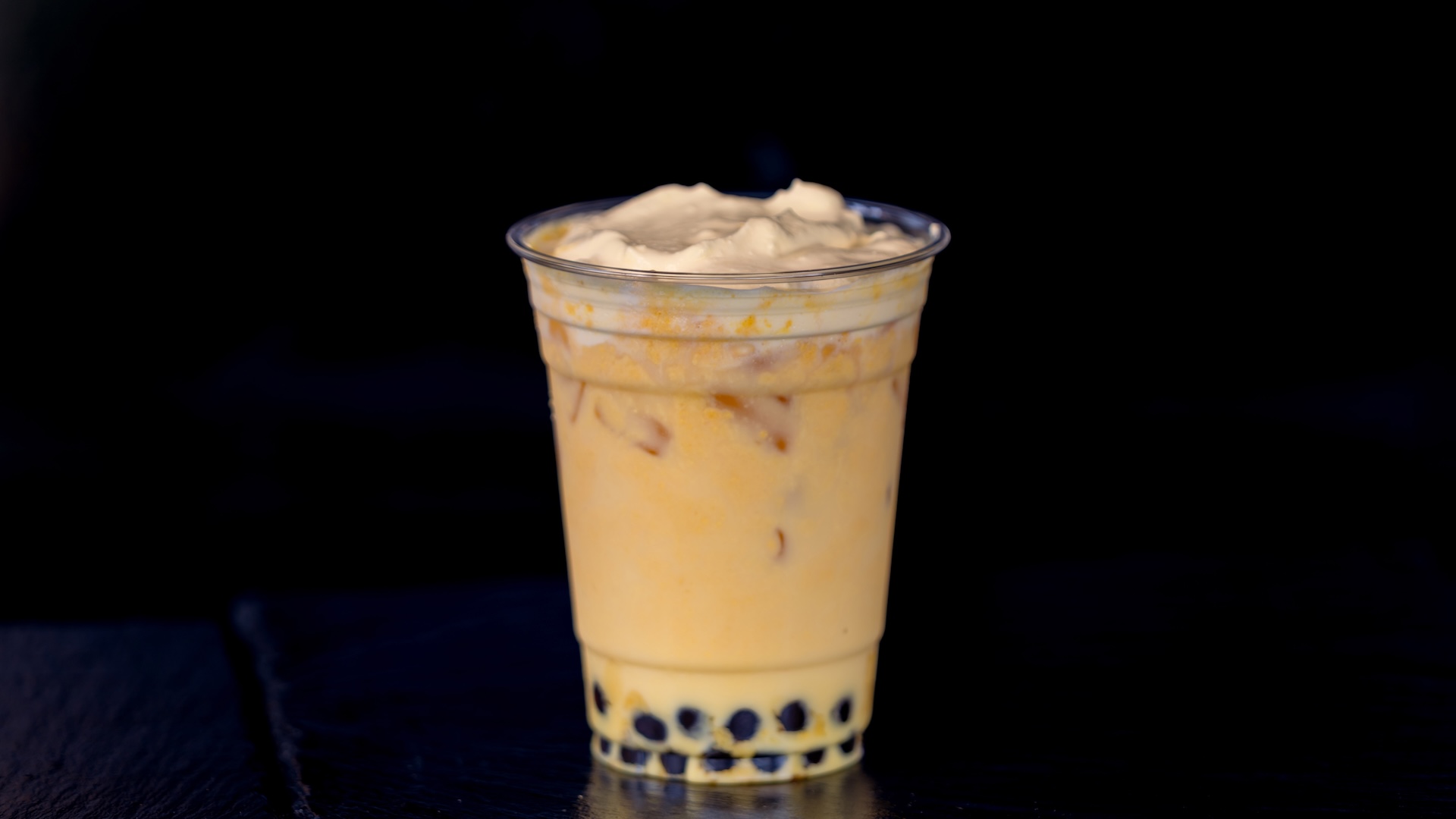 Mango Milk Tea with brown sugar tapioca spheres topped with pineapple cold foam (Non-alcoholic) (New)