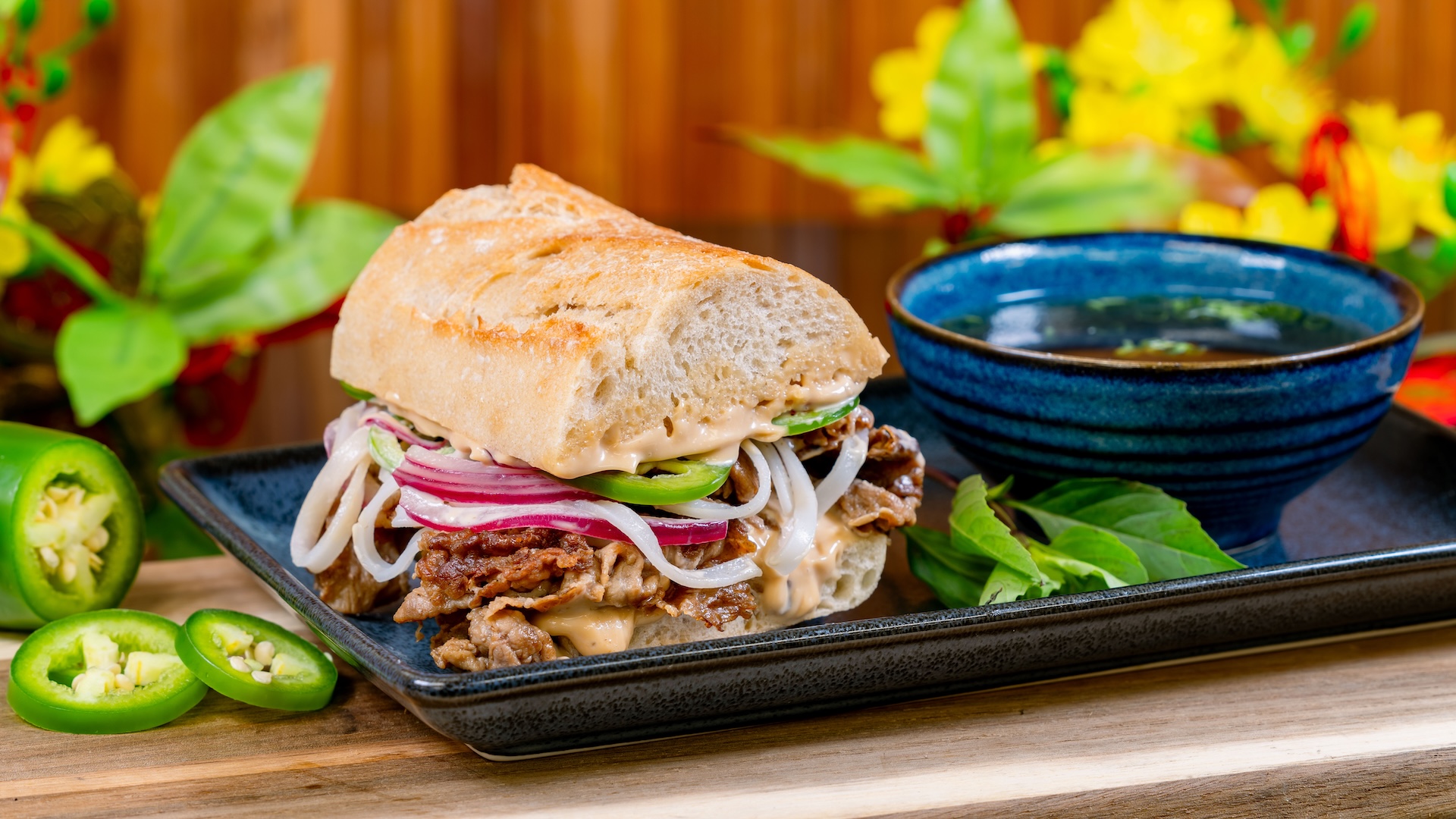 Phở Dip with rice noodles, sliced beef, shaved jalapeños, pickled onions, and phở broth