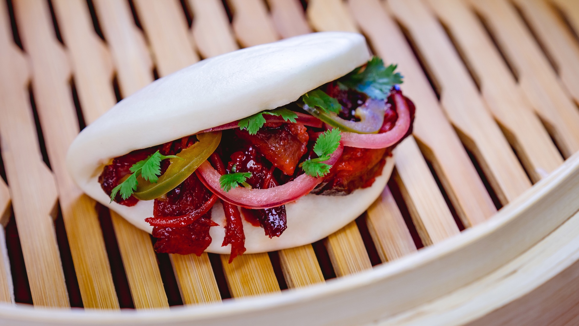 Char Siu BBQ Pork Bao with pickled red onions and jalapeño