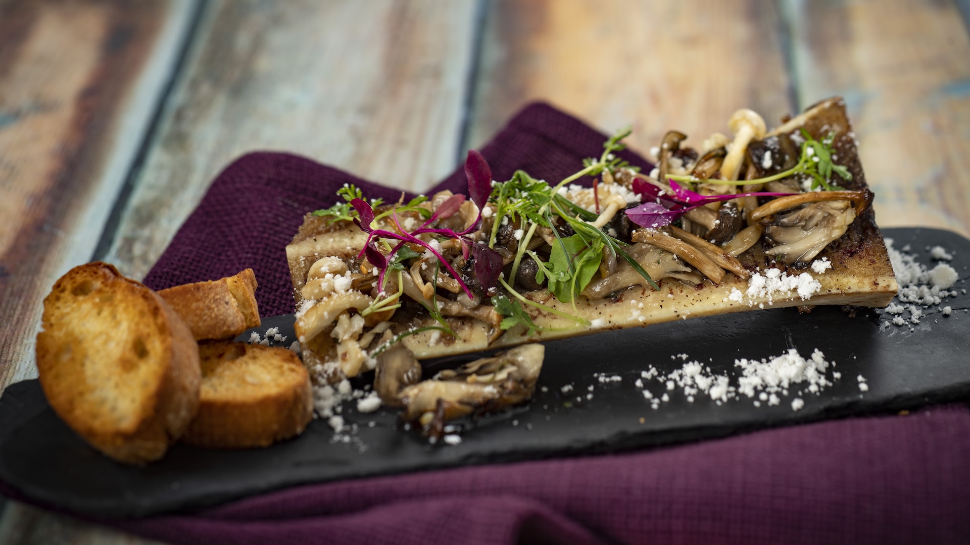 Roasted Bone Marrow with onion marmalade, pickled mushrooms, and petite lettuce