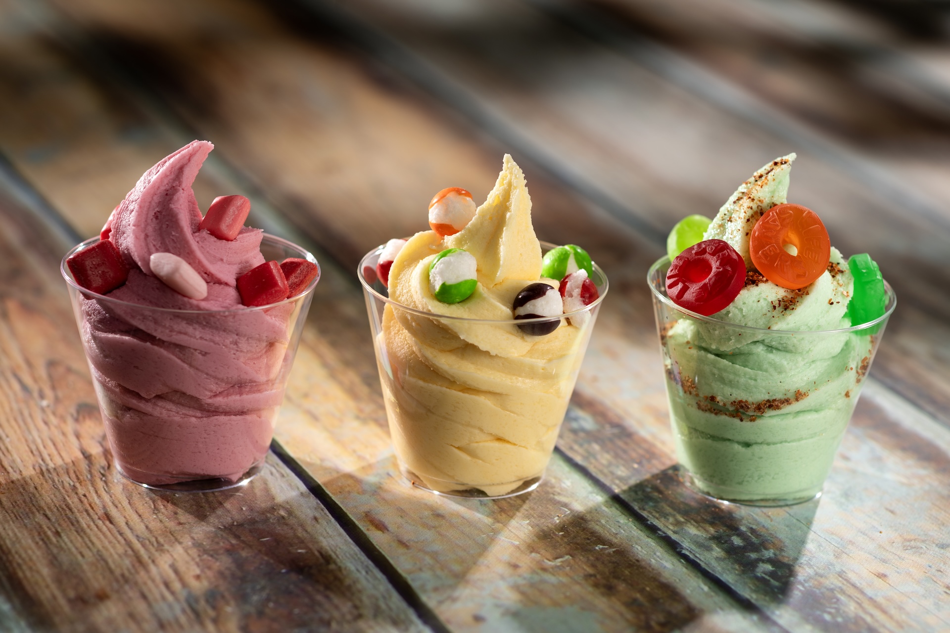 Candy Trio Flight: DOLE Whip Strawberry with STARBURST MINIS fruit chews, DOLE Whip Lemon with SKITTLES POP’d Original Freeze Dried Candy, and DOLE Whip Lime with chili-lime seasoning and LIFE SAVERS gummies