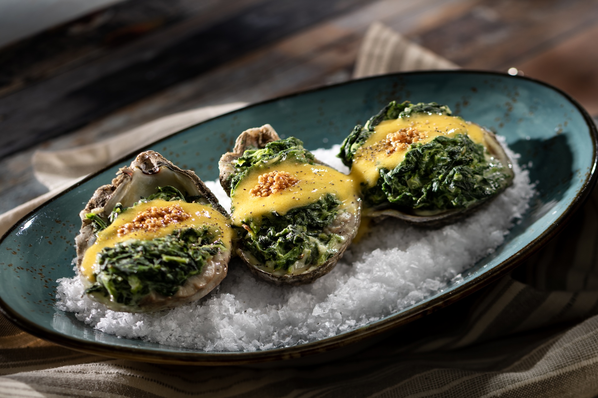 Chapter 1: Beach Oysters: Grilled oysters, mustard seed-peppercorn sabayon, and creamed spinach (New)