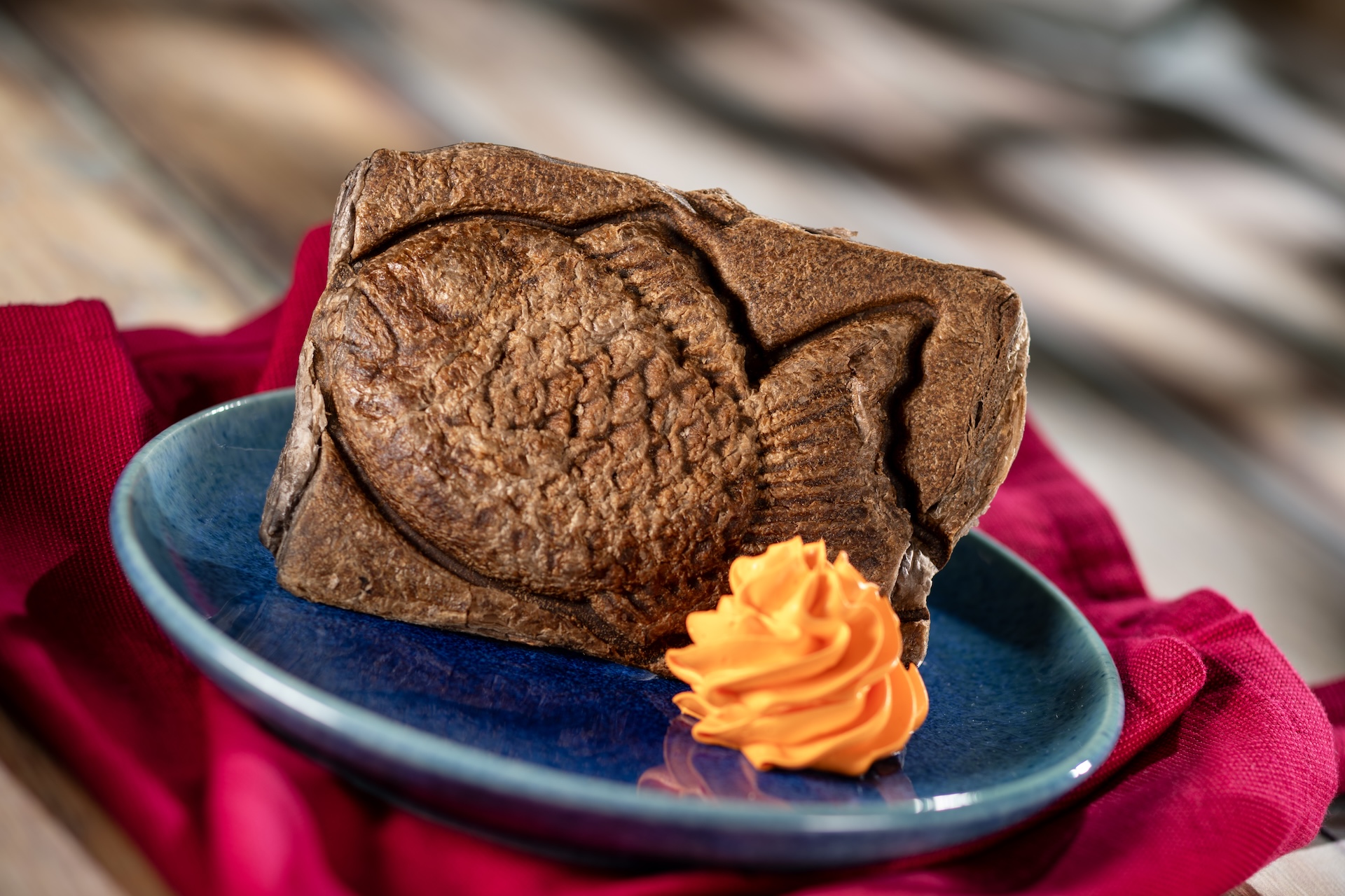 Taiyaki: Crisp, flaky fish-shaped chocolate-flavored pastry filled with custard and served with whipped topping (New)